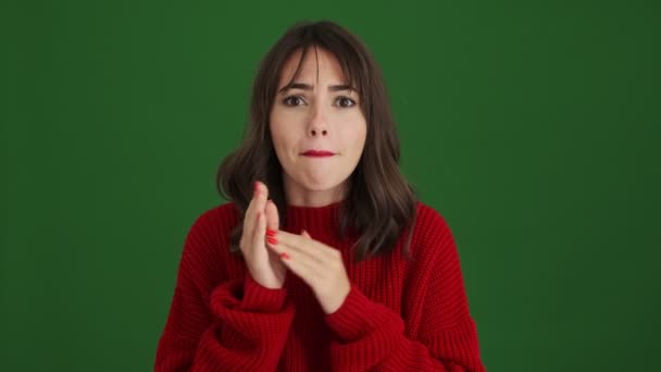 Happy Woman Red Sweater Doing Winner Gesture Standing Isolated Green — Stock Video