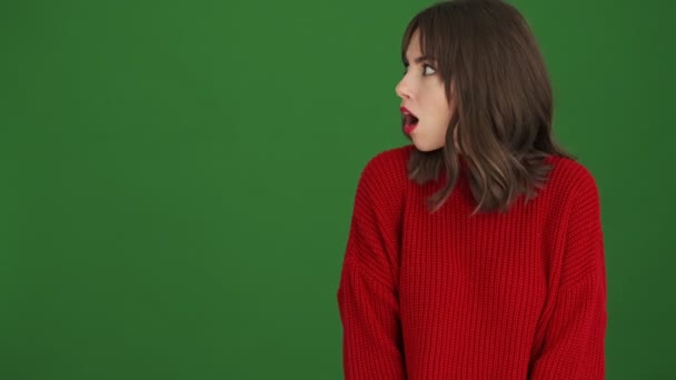 Surprised Young Woman Red Sweater Pointing Free Space Standing Isolated — Stock Video