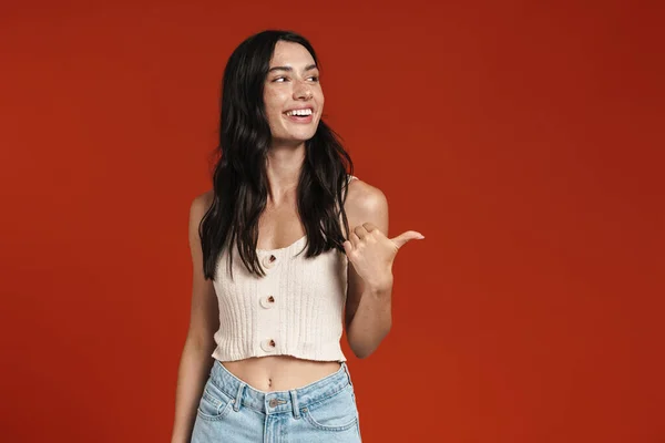 Imagen Joven Mujer Feliz Sonriendo Señalando Con Dedo Lado Aislado —  Fotos de Stock