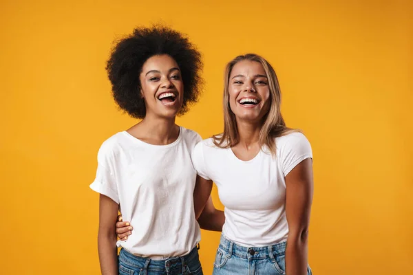 Image Laughing Young Multiracial Girls Friends Posing Isolated Yellow Wall — Stock Photo, Image