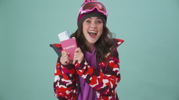 Positive Young Woman Snowboarder Holding Boarding Pass Tickets Standing Isolated — Stock Video