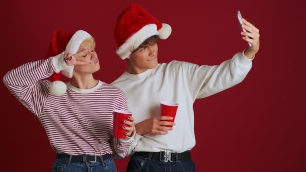 Young Happy Girl Her Brother Christmas Santa Hat Taking Selfie — Stock Video