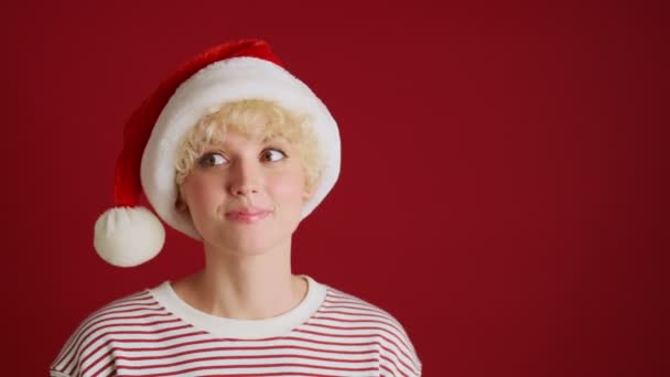 Young Happy Guy Covering Eyes His Sister Christmas Santa Hat — Stock Video