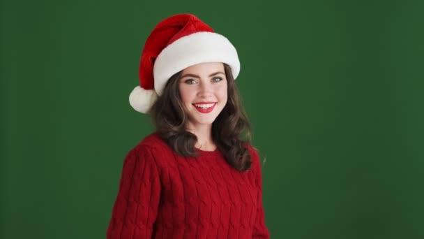 Pretty Happy Positive Girl Christmas Santa Hat Blowing Kisses Isolated — Stock Video