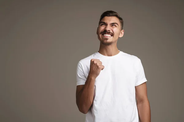 Image Excited Unshaven Guy Making Winner Gesture Isolated Grey Background — Stock Photo, Image