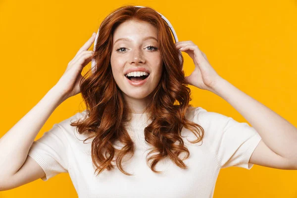 Image Ginger Happy Girl Smiling Using Headphones Isolated Yellow Background — Stock Photo, Image