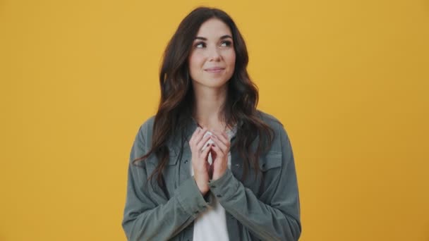 Smiling Woman Plotting Something Standing Isolated Yellow Background — Stock Video