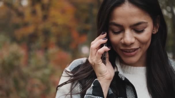 Positive Woman Talking Her Smartphone While Walking Autumn Park — Stock Video