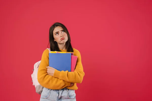 Afbeelding Van Ongelukkige Mooie Student Meisje Poseren Met Oefenboeken Geïsoleerd — Stockfoto