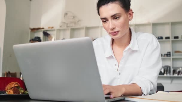 Cropped View Young Focused Woman Using Her Laptop Computer Sitting — Stock Video