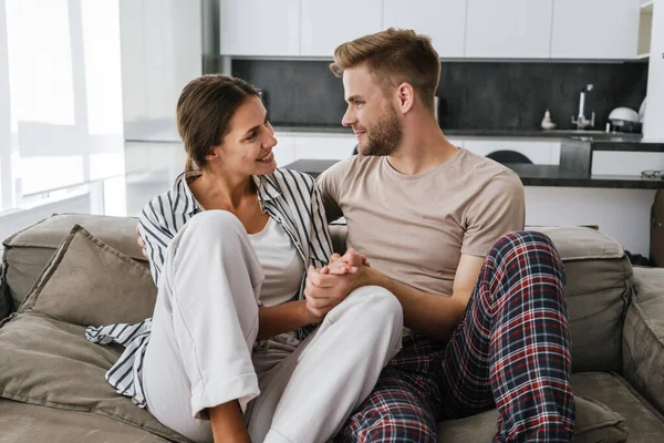 Young Beautiful Caucasian Couple Smiling Hugging Together While Sitting Sofa — Stock Photo, Image