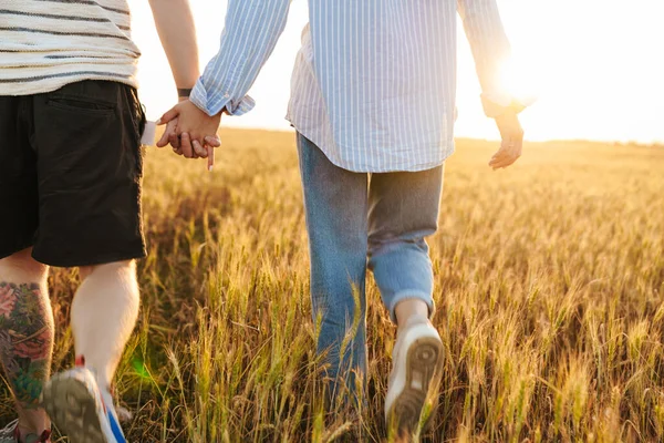 Cropped Photo Loving Couple Walking Together Field Holding Hands Each — Stock Photo, Image