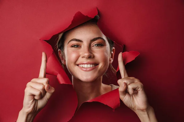 Excited Girl Peeping Hole Paper Isolated Presenting Copy Space — Stock Photo, Image