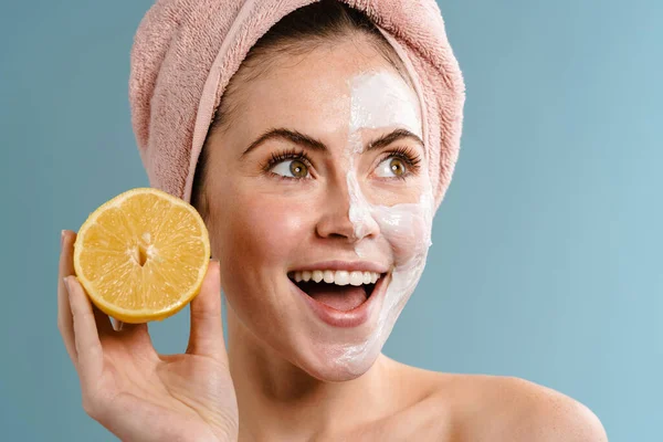 Shirtless Excited Girl Nourishing Mask Holding Lemon Isolated Blue Background — Stock Photo, Image