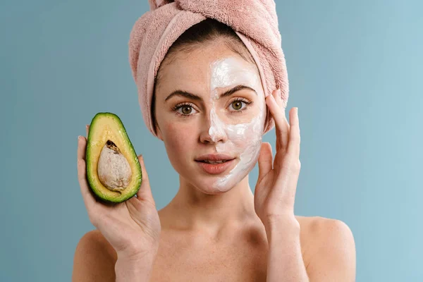 Shirtless Beautiful Girl Nourishing Mask Holding Avocado Isolated Blue Background — Stock Photo, Image