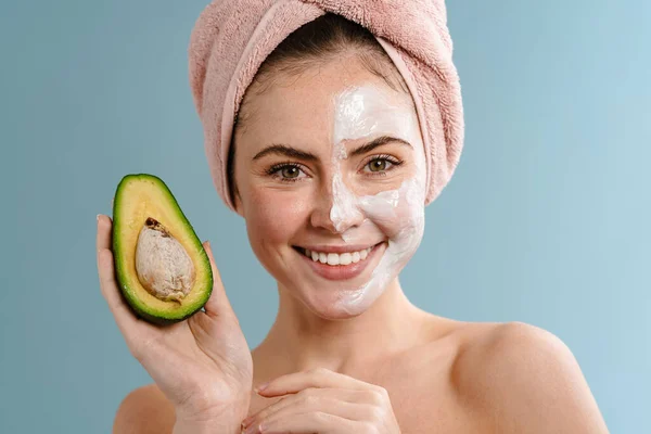 Shirtless Happy Girl Nourishing Mask Holding Avocado Isolated Blue Background — Stock Photo, Image