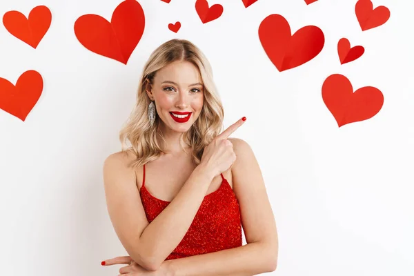 Photo Young Positive Blonde Woman Red Dress Pointing Isolated White — Stock Photo, Image