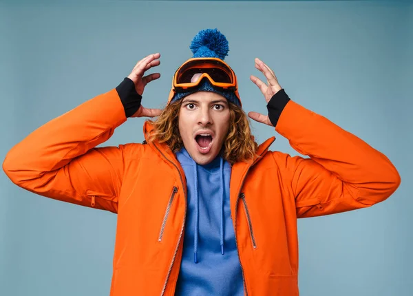 Close Excited Young Man Wearing Winter Jacket Standing Isolated Blue — Stock Photo, Image