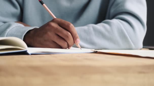 Close Cropped View Young African American Man Writing Something His — Stock Video