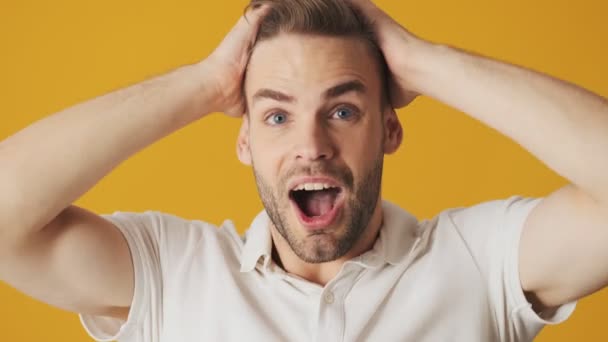 Handsome Young Excited Shocked Man Looking Camera Isolated Yellow Wall — Stock Video