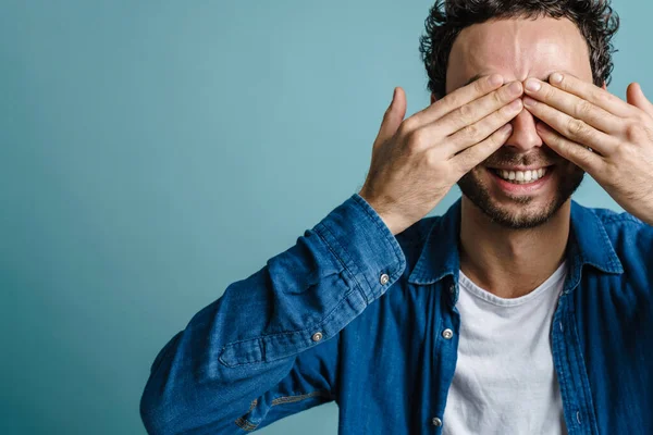 Cheerful Handsome Guy Smiling Covering His Eyes Isolated Blue Background — Stock Photo, Image