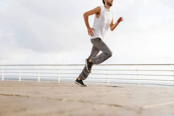 Focused Unshaven Guy Running While Working Out Promenade — Stock Photo, Image