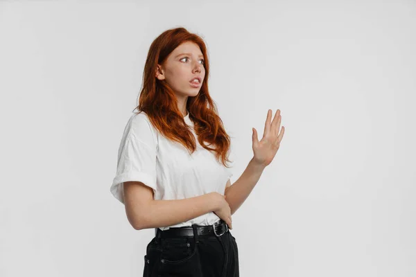 Ginger Beautiful Scared Girl Looking Aside Making Stop Gesture Isolated — Stock Photo, Image