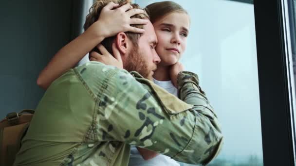 Close View Calm Soldier Man Hugging His Sad Young Daughter — Stock Video