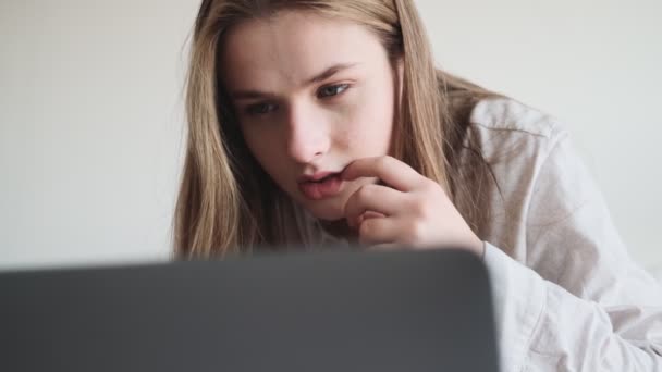 Concentrated Woman Using Her Laptop Computer While Sitting Bed White — Stock Video