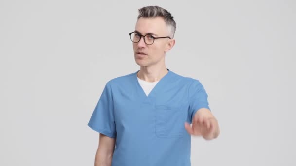 Serious Doctor Man Wearing Uniform Showing Stop Gesture Standing Isolated — Stockvideo