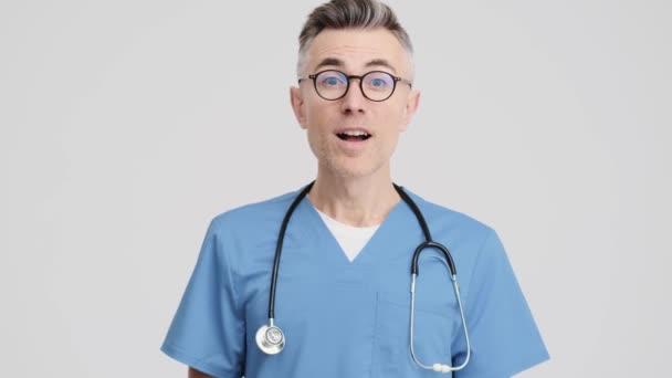 Happy Senior Doctor Man Wearing Medical Uniform Showing Thumb Gesture — Stockvideo