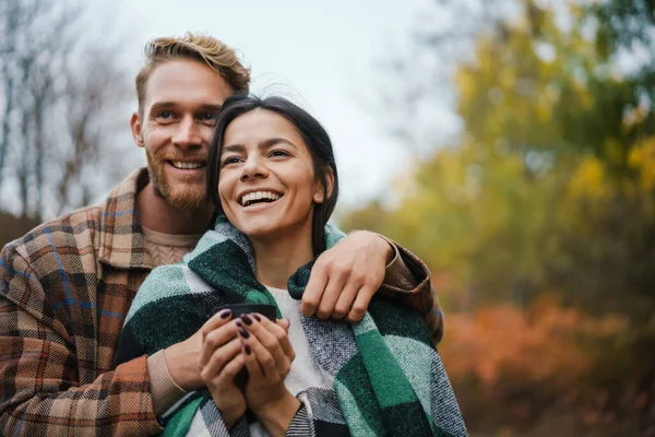 Young Happy Couple Drinking Tea Hugging While Having Picnic Autumn — Stock Photo, Image