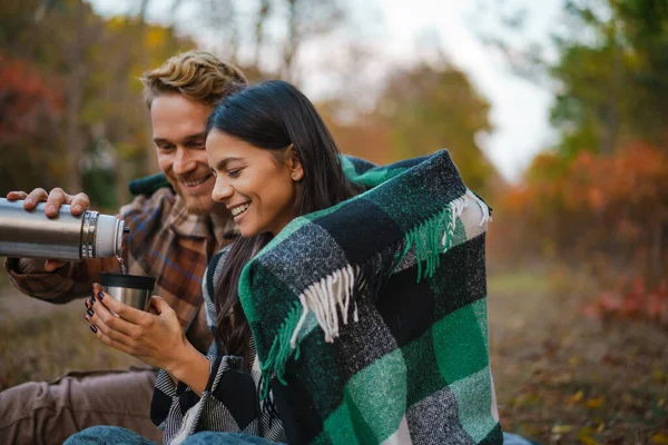 Young Happy Couple Drinking Tea Hugging While Resting Autumn Forest — Stock Photo, Image