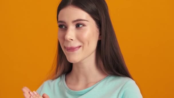 Glad Young Woman Clapping Her Hands Standing Isolated Orange Background — Stock Video