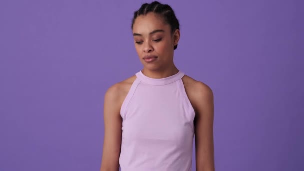 Serious Young Woman Shagging Shoulders Standing Isolated Violet Background Studio — Stock Video