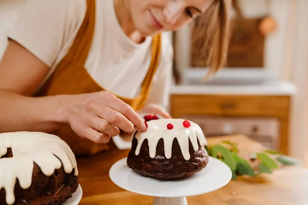 Caucasian Pleased Pastry Chef Woman Making Chocolate Cake Cozy Kitchen Stock Image