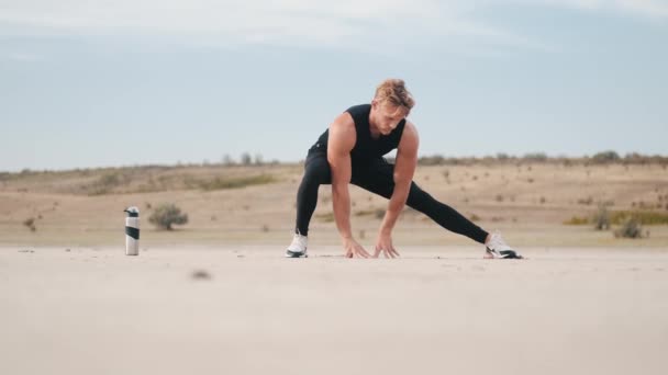 Strong Young Sportsman Doing Stretching Exercises His Legs While Training — Stok video