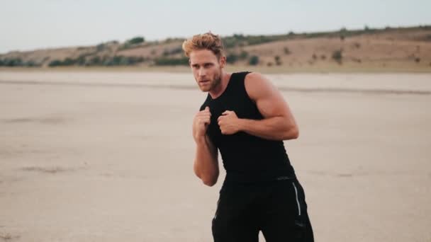 Muscular Young Sportsman Doing Tilts While Training Outdoors — Αρχείο Βίντεο