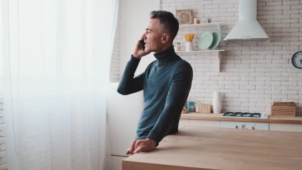 Man Standing Talking Phone Green Turtleneck Background Kitchen — Wideo stockowe