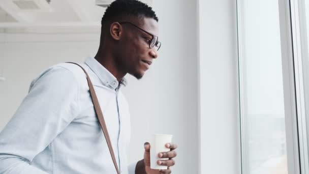 Handsome Black Guy Wearing Eyeglasses Drinking Paper Cup Something While — Αρχείο Βίντεο