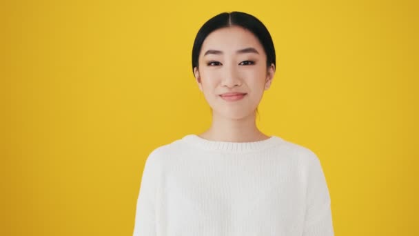 Beautiful Asian Woman Sending Air Kiss Camera Standing Isolated Yellow — Stock Video