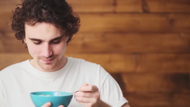 Portrait Smiling Curly Haired Man Eating Cereals Milk Laughing Camera — Stock videók