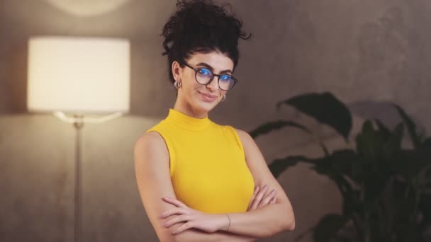 Happy Woman Yellow Shirt Taking Glasses While Standing Studio — Αρχείο Βίντεο