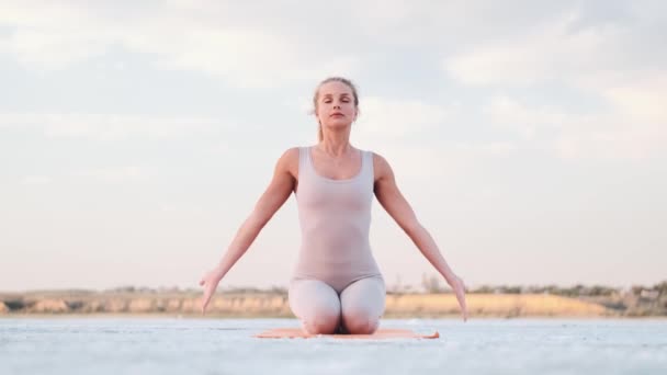 Beautiful Young Blonde Woman Closed Eyes Doing Yoga Holding Hands — Wideo stockowe