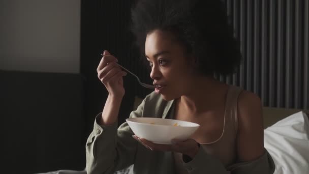 Black Happy Woman Having Breakfast Cereal Milk Holding Plate While — Stockvideo