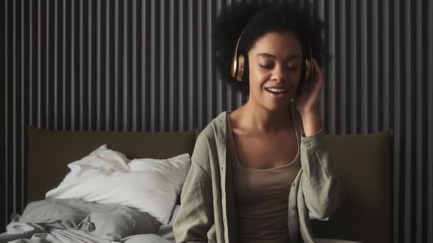 Happy Woman Headphones Listening Song Singing Words While Holding Hand — Wideo stockowe