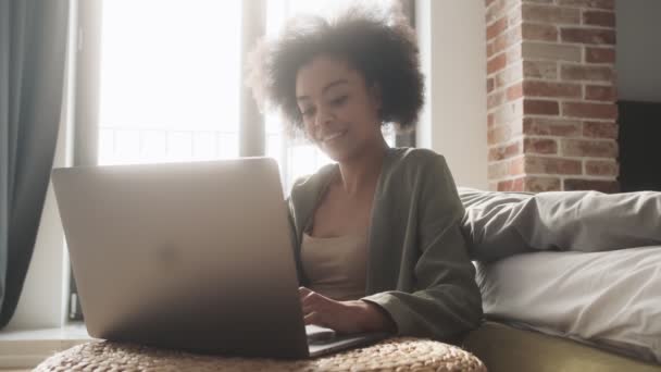 Smiling Black Woman Sitting Table Front Laptop Typing Something Room — Stockvideo