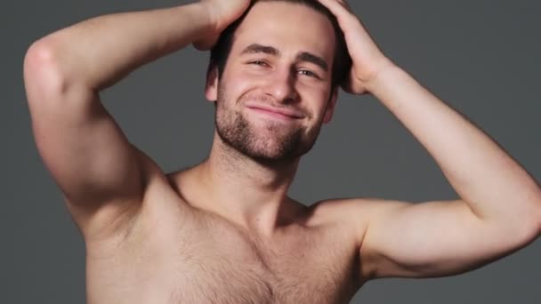 Handsome Man Touching His Head While Posing Camera Standing Isolated — Stock Video