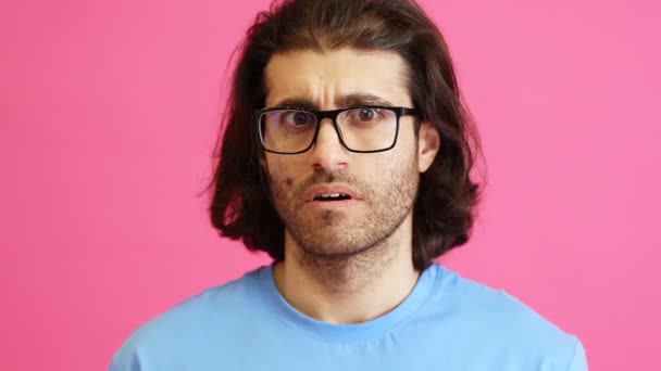 Close Shot Embarrassed Man Glasses Looking Pink Studio — Stok Video
