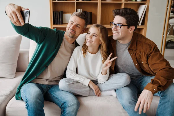 Happy Gay Family Gesturing Peace Sign While Taking Selfie Photo — Stock Photo, Image